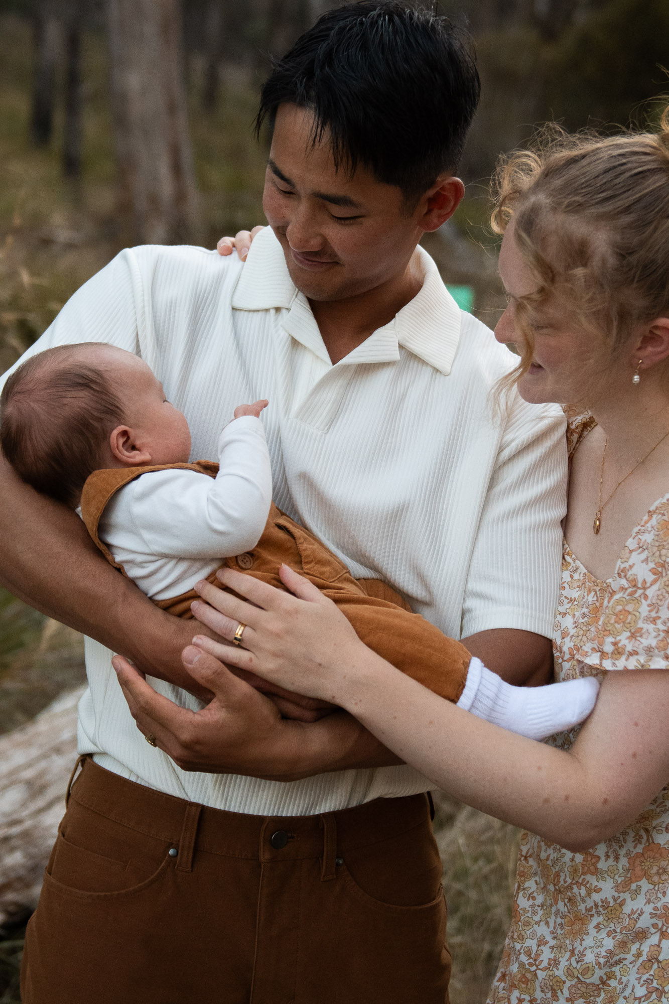 Newborn baby cradled in soft light, Launceston